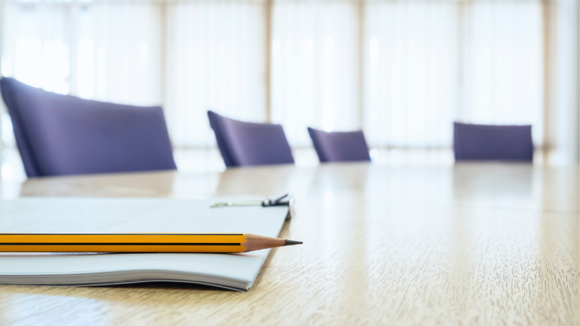 Decorative image of empty meeting table